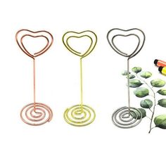 three different colored metal items with hearts on them