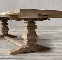 a wooden table sitting on top of a hard wood floor