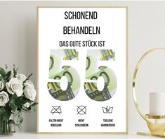 a poster with the number fifty five in german on it next to flowers and a candle