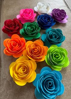 colorful paper flowers laid out on the floor