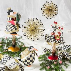 christmas decorations are arranged on top of each other in black and white checkerboard