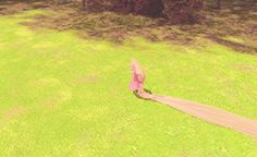 a woman walking across a lush green field