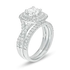 a white gold engagement ring set with two rows of diamonds