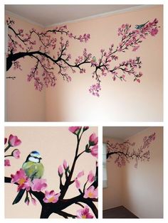 the wall is painted with pink flowers and a bird on it's tree branch