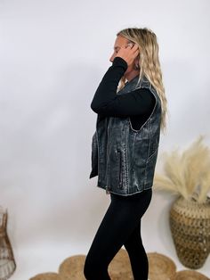 Washed Black PU Leather Moto Vest Rev up your style with our Washed Black PU Leather Moto Vest! This edgy piece is a must-have for adding a cool, rebellious vibe to any outfit. Featuring notched lapels, silver zipper detailing, and epaulets at the shoulders, this vest is all about those elevated details that make a statement. The relaxed fit ensures an amazing fit and feel, perfect for layering over your favorite tees or sweaters. Whether you're heading out for a night with friends or just want Edgy Biker Jacket With Zipper For Alternative Fashion, Distressed Punk Biker Jacket For Fall, Edgy Biker Jacket For Spring Alternative Fashion, Edgy Spring Biker Jacket For Alternative Fashion, Zipper Closure Biker Jacket For Alternative Fashion In Fall, Black Edgy Biker Jacket For Alternative Fashion, Distressed Black Punk Outerwear, Black Distressed Punk Outerwear, Biker Outerwear With Zipper For Alternative Fashion