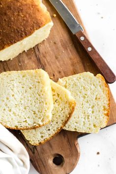 slices of bread on a cutting board next to a knife