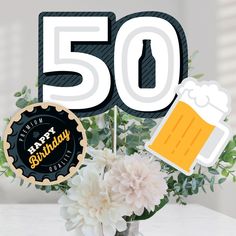 a birthday cake topper with a beer mug and flowers in front of the number 50