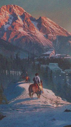 two people riding horses on top of a snow covered mountain