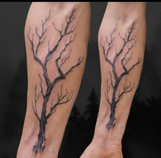 two bare branches on both legs are shown in this tattoo artist's work,