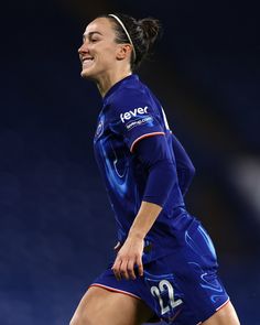 a female soccer player in action on the field