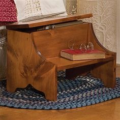 a small wooden piano sitting on top of a rug