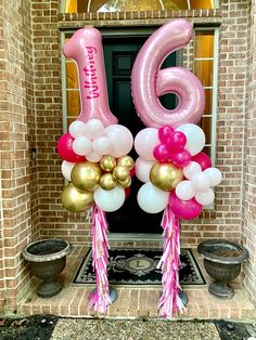 balloons and streamers decorate the front door of a home for a 16th birthday party