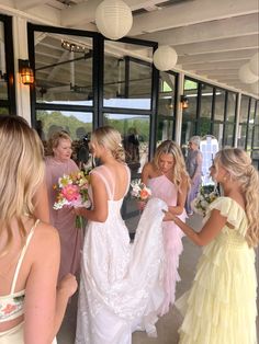 the bridesmaids are getting ready to walk down the aisle