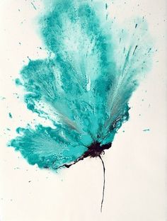 a blue flower is flying through the air