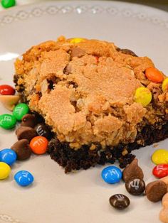 a white plate topped with a cookie and candy bar