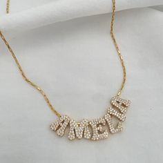 So funky, so original - the Y2K Name Necklace is droppin' all the '00s feels. Rock it solo or let it shine on its own. gold-plated pave set letter beads measure approximately 14x12mm high-quality gold plated elongated box chain personalize with up to 8 characters (letters only) Character Letters, Let It Shine, Code Black, Letter Beads, Shine On, Box Chain, 14kt Gold, Name Necklace, Heart Necklace