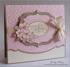 a pink and white card with flowers on the front, saying wonderful life in it