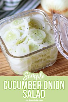 an onion and cucumber salad in a plastic container on a wooden cutting board