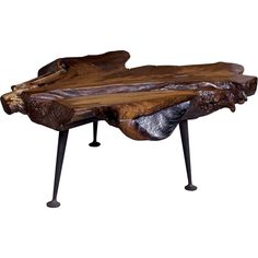 a wooden table with metal legs and a wood slab on the top that is shaped like an elephant's foot