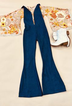 - Express Your Unique Vibe -  Get ready to groove in style with our Kids Denim Retro Style Jumpsuit! Made from soft and durable denim fabric, this jumpsuit is the perfect combination of comfort and style. Featuring a vintage print exaggerated bell sleeve top with trim detailing and bell bottoms, this jumpsuit is available in light and dark wash denim options. Whether your child prefers the classic blue of light wash denim or the edgy look of dark wash denim, we've got you covered! Our Kids Denim Retro Style Jumpsuit is available in a range of sizes to fit children of all ages and body types. The playful design and comfortable fit make it a must-have for any fashion-conscious child who loves to have fun and express their individuality. So, whether your child is headed to a party or just pla Retro Fitted Overall Bottoms, Retro Fitted Overalls, Fitted Overall Pants For Fall, Fitted Overalls For Fall, Fitted Fall Overalls Pants, Fitted Blue Denim Retro Jumpsuit, Retro Fitted Medium Wash Jumpsuits And Rompers, Retro Fitted Denim Jumpsuit Overall, Retro Dark Wash Denim Jumpsuit