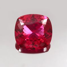 a large red diamond sitting on top of a table