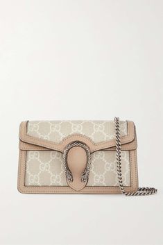 GUCCI Dionysus super mini leather-trimmed coated-canvas shoulder bag | NET-A-PORTER Luxury Beige Shoulder Bag With Silver-tone Hardware, Designer Gucci Shoulder Bag With Palladium Hardware, Luxury Gucci Bags With Metal Hardware, Gucci Beige Bags With Silver-tone Hardware, White Gucci Bag, Gucci Monogram Bag, Gucci Dionysus Super Mini, Bag Wishlist, Tas Gucci