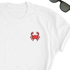 We have express delivery for our shirts! 📦⚡.  From cart to door in just 2-3 days, only for 3.5 USD extra.  You can find the express delivery option in the cart. Crab Shirt, Red Crab Tee Shirt, Crab Tee Top, Red Crab T-Shirt,  Crab Gift Shirt, Cut Crab Friends UNISEX Shirt Gift Friends will love it! This t-shirt feels soft and lightweight, with the right amount of stretch. It's comfortable and flattering for both men and women.  * 100% cotton (heather colors contain polyester) * Fabric weight: 5 oz  * Shoulder-to-shoulder taping * Side-seamed Time for Delivery: * Processing & production time is 1-6 business days (usually 2-3 days). * U.S. Shipping time: 3-5 business days.  * International shipping time: 4-15 days. - Please note European customers: Some orders going to Europe are shipped fr Crab Shirt, Red Crab, Shirts & Tops, Unisex Shirt, Top Tee, White Shirt, Crab, Tee Shirt, Fabric Weights