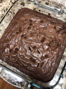 a chocolate cake sitting on top of a glass pan