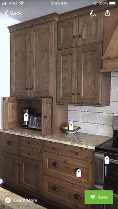 a kitchen with wooden cabinets and an appliance on the wall next to it