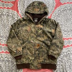 Euc. Small Marks. Youth Size Xl 18/20, Fits Like A Womens S. Carhartt Duck Insulated Jacket. Realtree Camouflage. “Heavyweight, 12-Ounce 100% Ring-Spun Washed Cotton Duck. Quilted Lining. Featherless Insulation For Warmth Without The Weight. Carhartt-Strong, Triple-Stitched Main Seams. Rib-Knit Waist And Storm Cuffs Help Keep Out The Cold. Attached Hood. Two Front Pockets. One Inner Pocket” C491 Firm Price Womens Carhartt Jacket, Carhartt Jacket Women's, Womens Hunting Clothes, Carhartt Womens Jacket, Camo Jacket Women, Vintage Camo Jacket, Real Tree Camouflage, Carhartt Jackets, Carhartt Womens