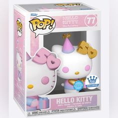 the hello kitty pop vinyl figure is in a box with its pink and gold hat