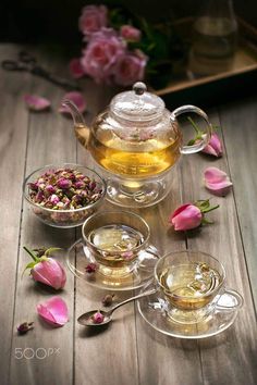 tea and flowers on a wooden table