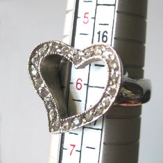 Open heart sweetheart ring. 925 sterling silver with clear rhinestones. The ring measures to a US size 6. There are no markings on the inside. It is in very nice condition with no signs of wear. Thanks for looking! vintagedame.etsy.com Silver Heart Ring With Diamond Accents, Sweetheart Jewelry, Vintage Cocktail Ring, Modernist Ring, Ring Heart, Vintage Cocktail, Green Enamel, Open Heart, Valentine Gift