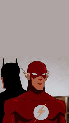 the flash and batman are facing each other