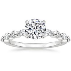 a white gold engagement ring with diamond accents