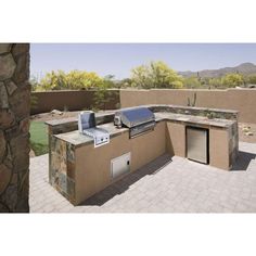 an outdoor bbq with grill, sink and oven