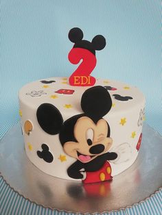 a mickey mouse birthday cake with the number one on it's top and ears