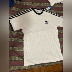 Brand New Never Worn, It Has A Small Stain On The Back ( 3rd Picture) Length~ 25 In Pit To Pit~ 18 In Adidas White, Adidas Shirt, White Adidas, Adidas Men, Adidas Originals, Color White, Tee Shirts, Stain, Mens Shirts