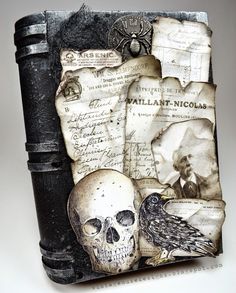 an altered photograph of a skull and a bird on a black box with papers all over it