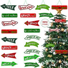 a christmas tree with many different signs hanging from it's sides and arrows pointing in different directions