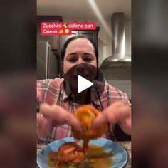 a woman is eating food from a blue plate