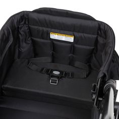 an empty black stroller with no wheels on the back and one seat folded down