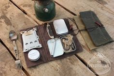 an assortment of utensils laid out on a picnic table