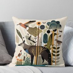 an animal themed throw pillow sitting on top of a couch