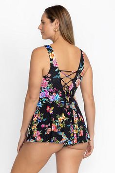 A feminine swimwear silhouette, the Sognatore Nero Back Tie Skirted One Piece boasts vibrant blooms on a rich backdrop. Featuring a deep V-neckline and flowing skirted bottom, this one-piece swimsuit is crafted from a unique fabric that blocks 99.5% of UV rays. Layer with a flowing kimono and add a beach tote for a perfectly put-together surfside look. Johnny Was Women's Sognatore Nero Back Tie Skirted One, Size XL Floral Print Tankini With Tie-side Bottom For Poolside, Floral Print Triangle Top Tankini For Swimming, Floral Print Stretch Swimwear With Tie-side Bottom, Floral Print Stretch Tankini For Beachwear, Floral Print Tankini With Tie-side Bottom For Vacation, Summer Floral Print Tankini With Tie-side Bottom, Fitted Floral Print Swim Dress For Beachwear, Floral Print Swim Dress For Spring, Sleeveless Floral Print Swim Dress