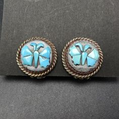 "VINTAGE BUTTERFLY TURQUOISE INLAY on MOTHER of PEARL EARRINGS DESCRIPTION: These exquisite earrings are made by artisans using sterling silver and genuine gemstones. The clip-on mechanisms are tight and secure. These elegant earrings will be a cherished addition to your collection of quality vintage Southwestern and Native American jewelry. MEASUREMENTS: Earrings measure 5/8\" across WEIGHT: 5.1 grams SIGNED: no STERLING: unmarked, verified sterling silver" Silver Inlay Round Earrings, Silver Inlay Earrings, Handmade Vintage Sterling Silver Earrings, Vintage Sterling Silver Round Earrings, Vintage Sterling Silver Earrings Stamped 925, Blue Vintage Sterling Silver Earrings, Handmade Vintage Sterling Silver Clip-on Earrings, Vintage Sterling Silver Round Clip-on Earrings, Vintage Sterling Silver Clip-on Earrings For Gift