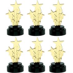 six gold stars on black pedestals with white background