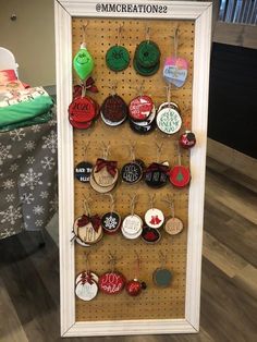 a white framed display with christmas ornaments on it