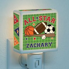 a night light with a sports themed design on the front and back of it that says, all star zachary