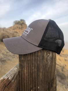 Grey baseball cap with white MCREY MX logo and black mesh. Adjustable hat. Backyard Cookout, Biking Outfit, Dirt Bike, Newest Trends, Motocross, One Size Fits All, Baseball Cap, Trucker Hat, The Sun